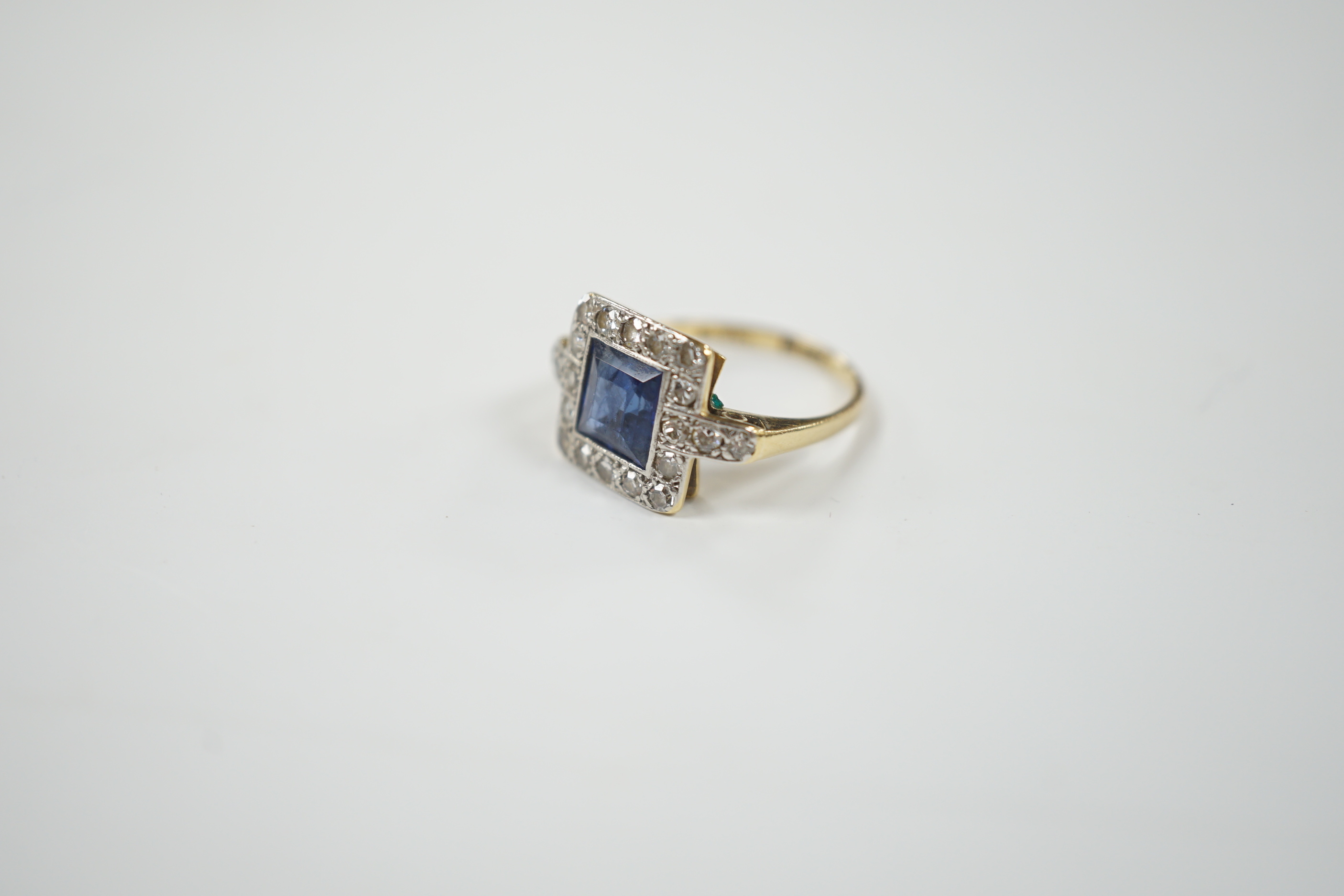 A 1940's/1950's 18ct gold & platinum, sapphire and diamond cluster set tablet ring, with diamond set shoulders, size G, gross weight 2.6 grams.